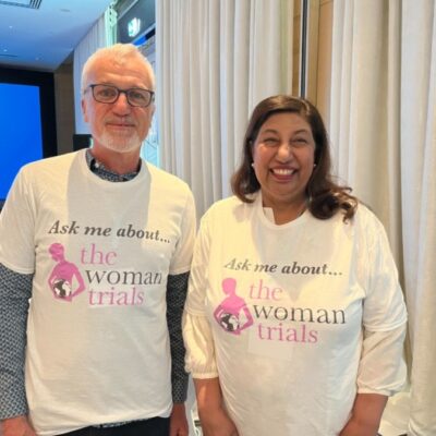 Two people wearing "Women’s Health" campaign t-shirts, posing together.