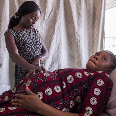 Dr Nike times the contraction of a woman to be sure that it is frequent and strong enough before she sends the patient to the labor ward.